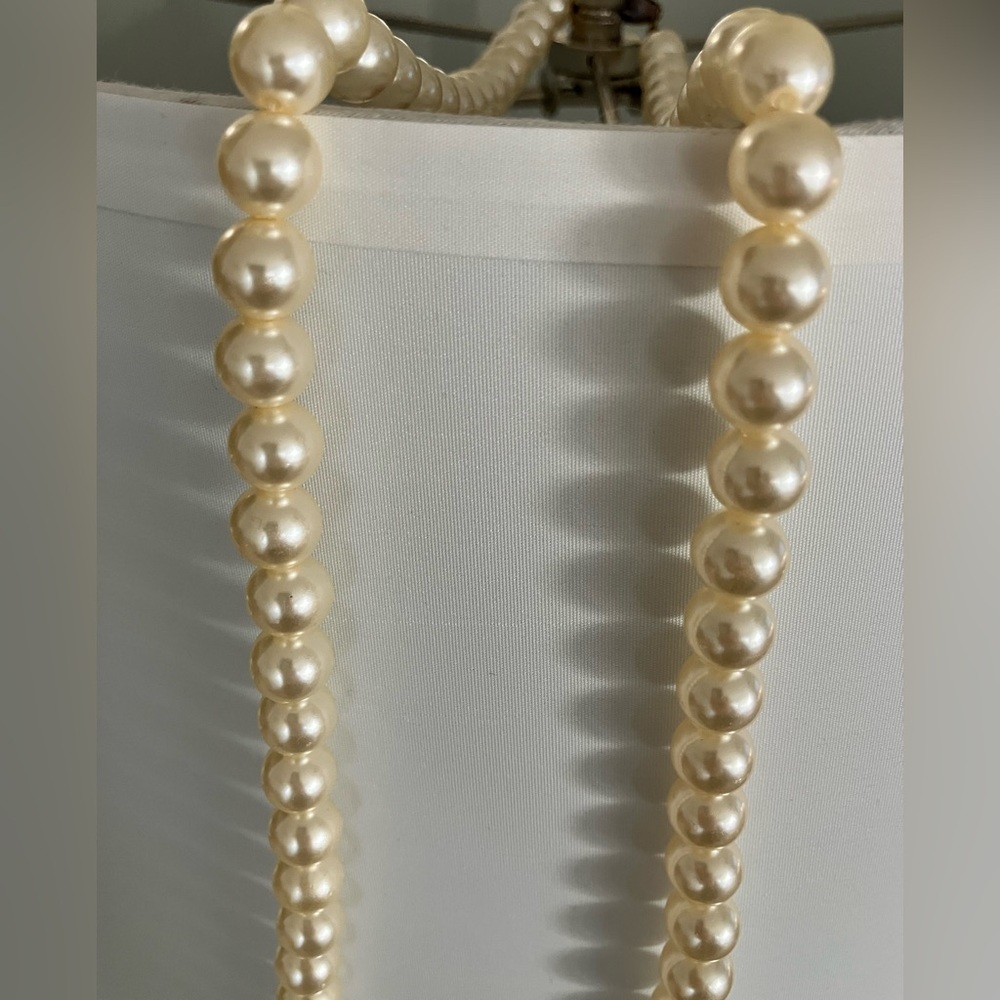 Vintage Strand of cultured inspired pearls with a yellow gold filigree clasp.